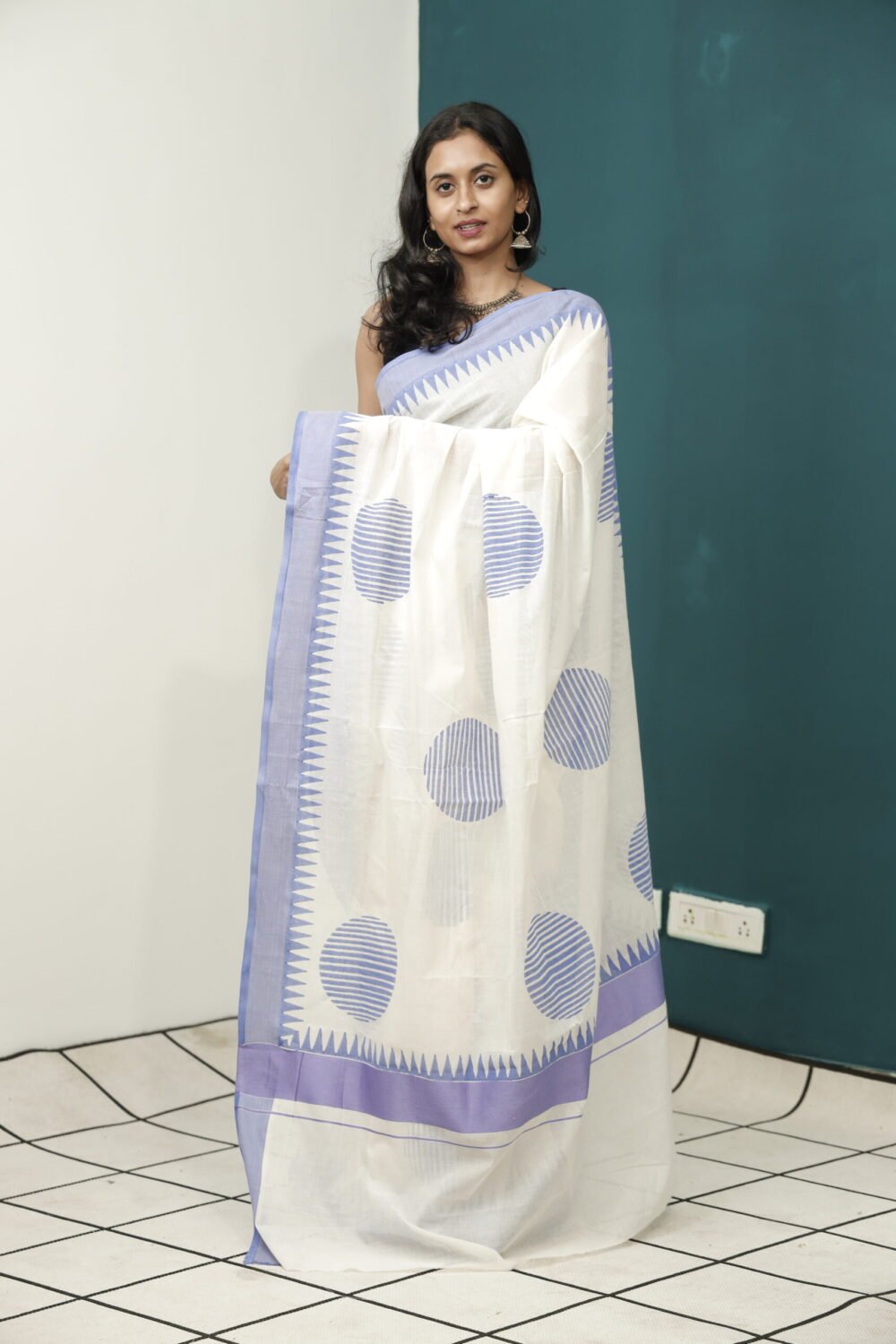 Timeless Elegance: The Kerala Saree with Blue Motifs and Purple Border - Image 2