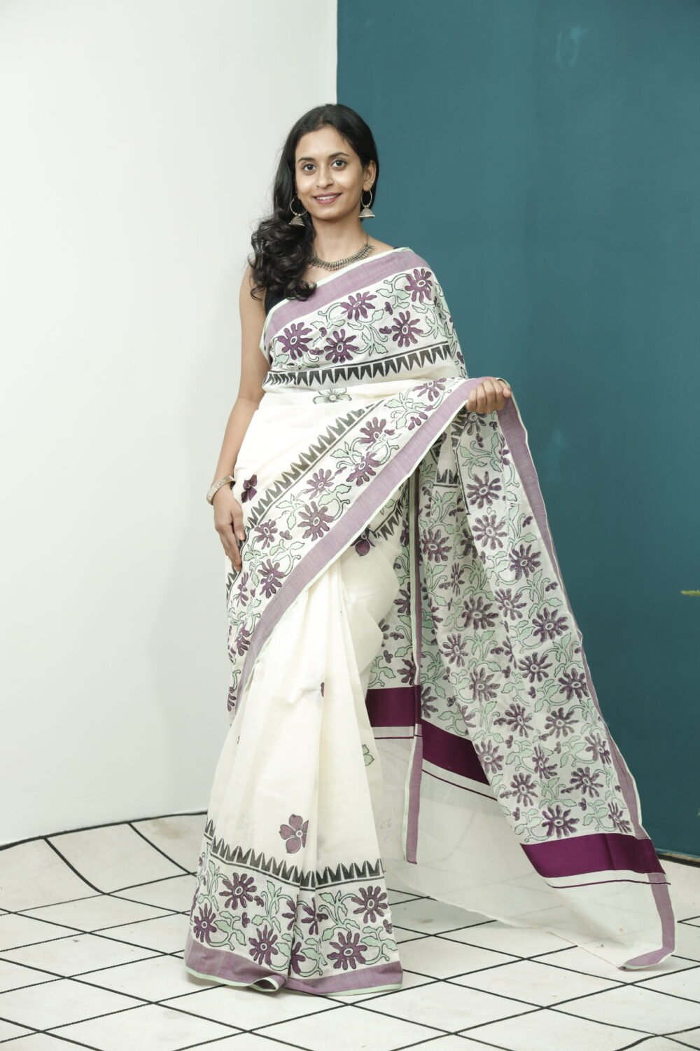 The Elegance of Kerala Sarees: Cream Base with Floral Block Print, Maroon Border, and White Kasavu
