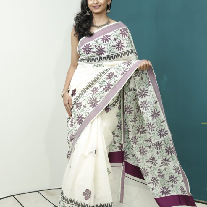 The Elegance of Kerala Sarees: Cream Base with Floral Block Print, Maroon Border, and White Kasavu